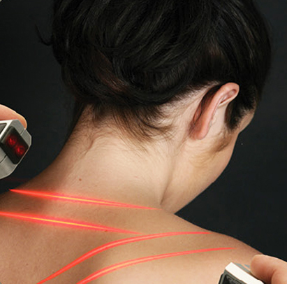 A clinician applying a low-level laser therapy session.